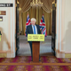 Matt Lucas playing Boris Johnson with Paul Hollywood and Prue Leith at adjacent lecterns